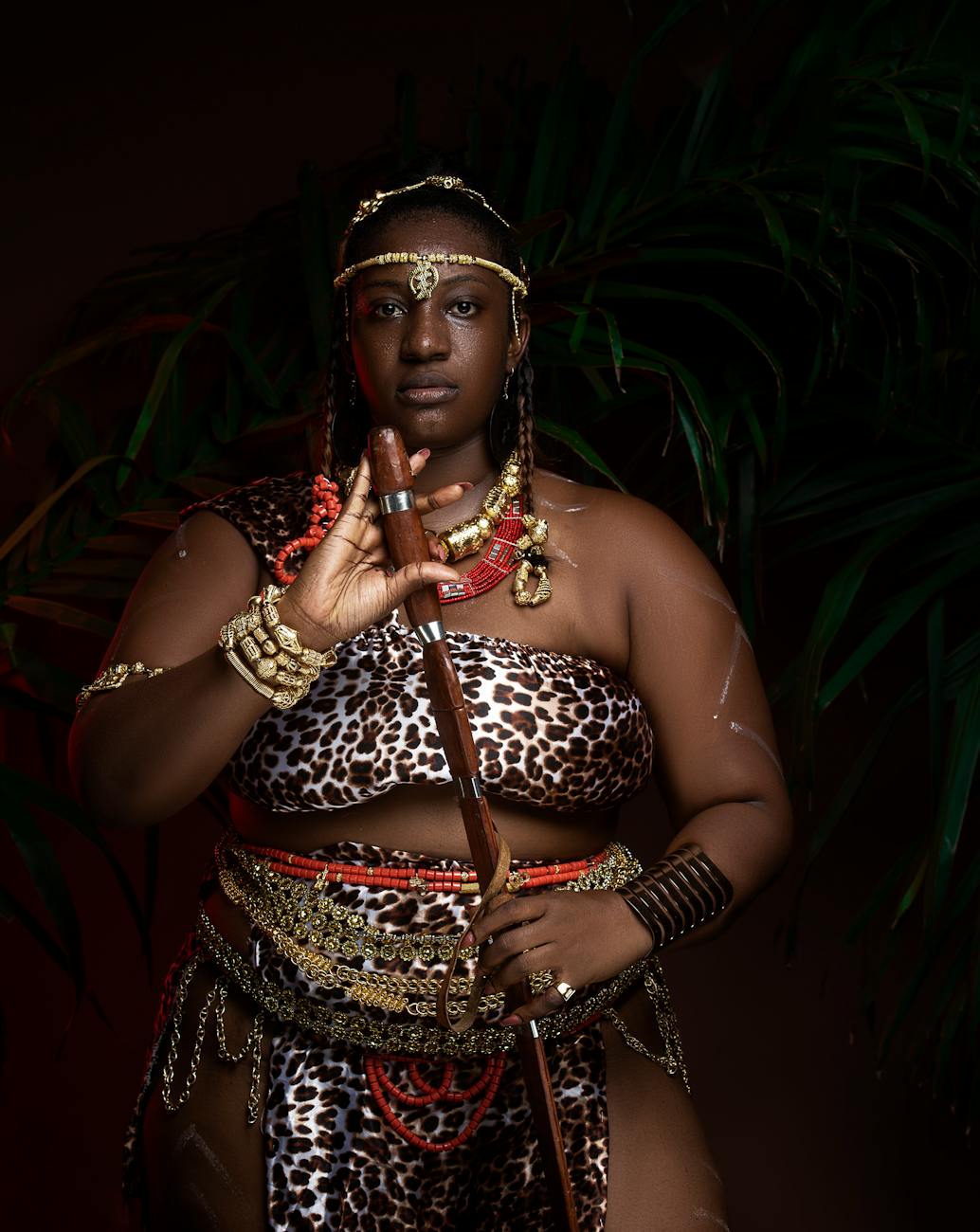 woman in african leopard skin dress and jewelry